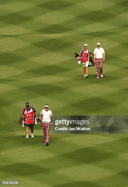 Ian Poulter and Ross Fisher of England during the Foursome's on the second day of the Omega Mission Hills World Cup on the Olazabal course on...