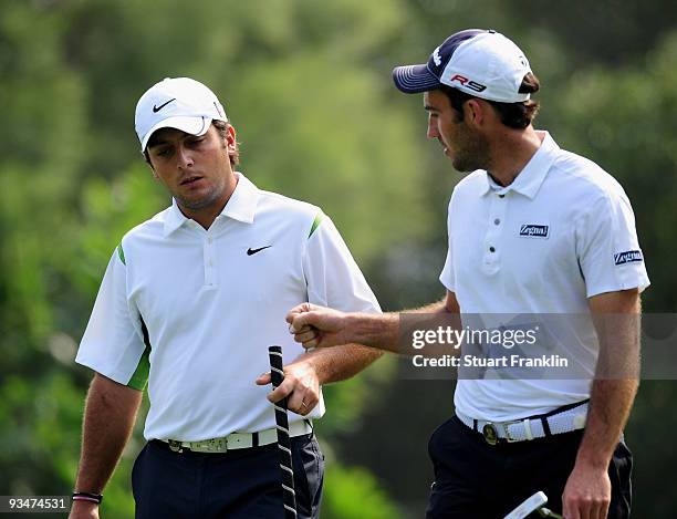 Francesco Molinari and Edoardo Molinari of Italy celebrate on the fifth hole during Foursomes on the final day of the Omega Mission Hills World Cup...