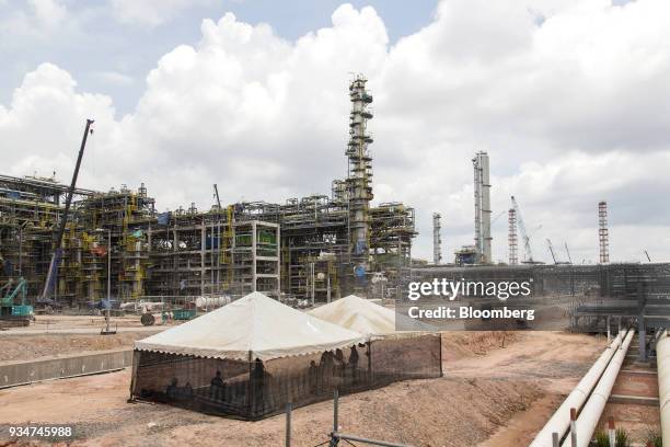 Workers rest in a marquee at the under construction Petronas Nasional Berhad Refinery and Petrochemical Integrated Development Project, part of the...