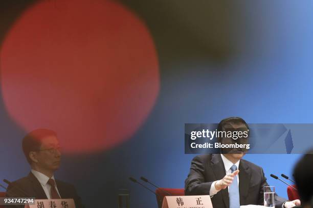 Li Keqiang, China's premier, right, speaks as Han Zheng, China's executive vice premier, looks on during a news conference following the closing of...