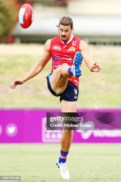 Tom Boyd of Footscray kicks the ball during a Western Bulldogs AFL training session at Whitten Oval on March 20, 2018 in Melbourne, Australia.