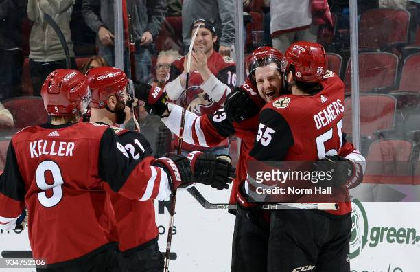 Oliver Ekman-Larsson of the Arizona Coyotes celebrates with teammates Clayton Keller, Derek Stepan and Jason Demers after scoring a goal against the...