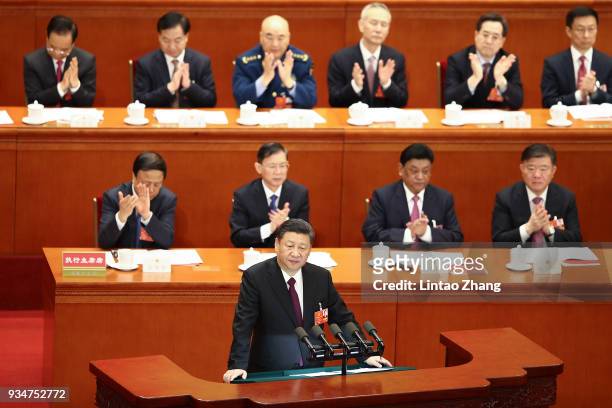 Chinese President Xi Jinping delivers a speech during the closing session of the National People's Congress at the Great Hall of the People on March...