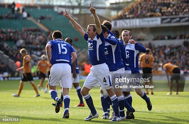 Lee Bowyer of Birmingham celebrates with team mates after scoring his team's first goal during the Barclays Premier League match between...