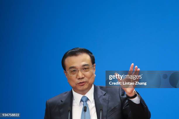 China's Premier Li Keqiang speaks during a news conference following the closing of the First Session of the 13th National People's Congress at the...