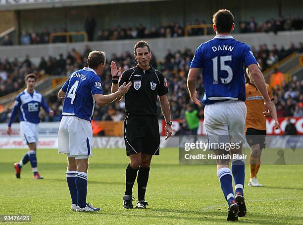 Lee Bowyer and Scott Dann of Birmingham protest to referee Mark Clattenburg during the Barclays Premier League match between Wolverhampton Wanderers...