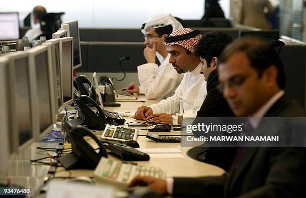 Arab and Foreign employees work at the Standard Chartered Bank's new trading room at the Dubai International Financial Center , on April 28 2008....