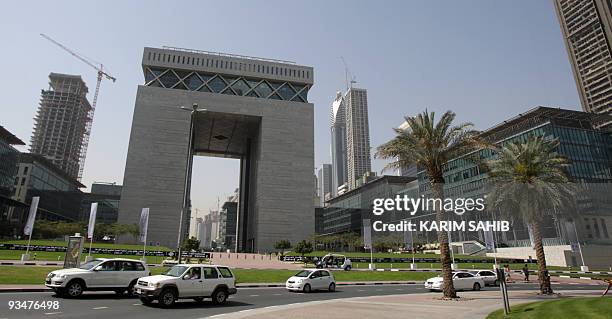 -- File picture taken on March 20, 2009 shows traffic rolling past the Dubai Interntional Financial Center in the Gulf emirate. The government of...