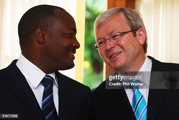 Former West Indies cricketer Brian Lara speaks to Australian Prime Minister Kevin Rudd before being presented with the insignia of the Order of...