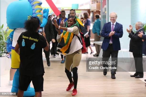 Elaine Thompson and Julian Forte of the Jamaican 2018 Commonwealth Games team arrive with Chairman Peter Beattie and CEO Mark Peters at the Gold...