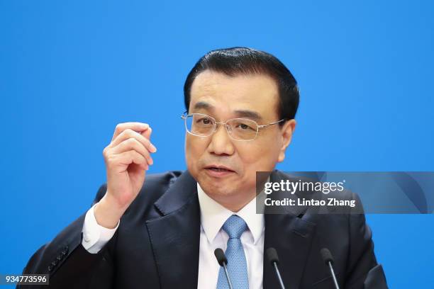 China's Premier Li Keqiang speaks during a news conference following the closing of the First Session of the 13th National People's Congress at the...