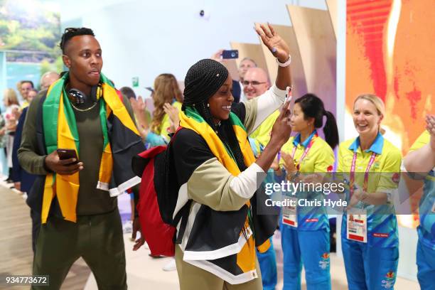 Elaine Thompson and Julian Forte of the Jamaican 2018 Commonwealth Games team arrive at the Gold Coast Airport on March 20, 2018 in Gold Coast,...