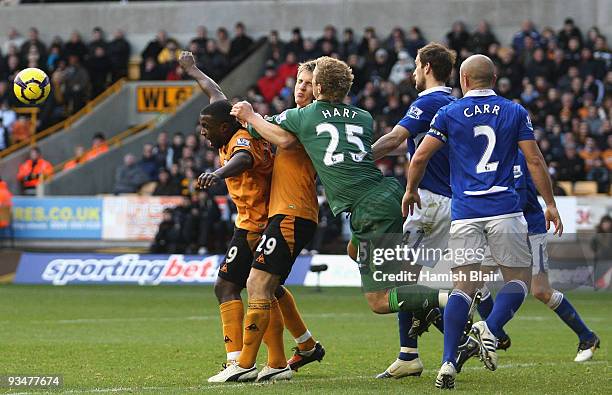 Joe Hart goalkeeper for Birmingham collides with Kevin Doyle of Wolverhampton as he punches the ball clear during the Barclays Premier League match...