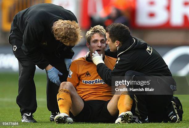 Kevin Doyle of Wolverhampton receieves treatment after collision during the Barclays Premier League match between Wolverhampton Wanderers and...