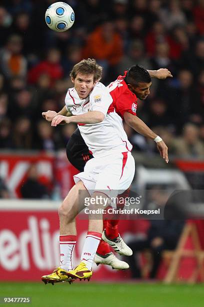 Alexander Hleb of Stuttgart and Arturo Vidal of Leverkusen jump for a header during the Bundesliga match between Bayer Leverkusen and VfB Stuttgart...
