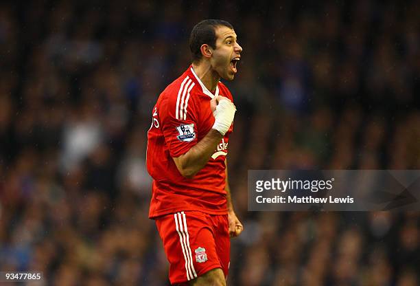 Javier Mascherano of Liverpool celebrates after the opening goal was scored via a deflection from Joseph Yobo of Everton during the Barclays Premier...