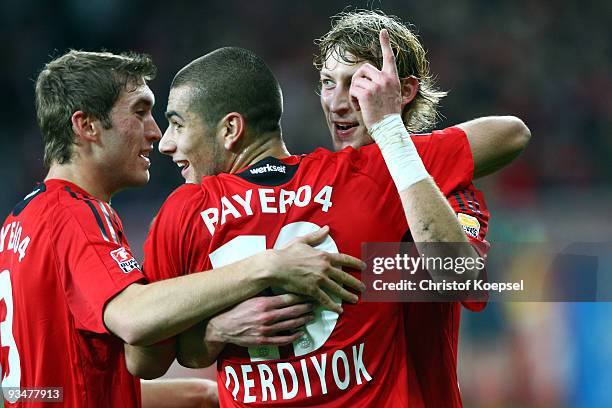 Stefan Kiessling of Leverkusen celebrates after scoring his team's first goal with team mates Eren Derdiyok of Leverkusen as well as Stefan Reinartz...