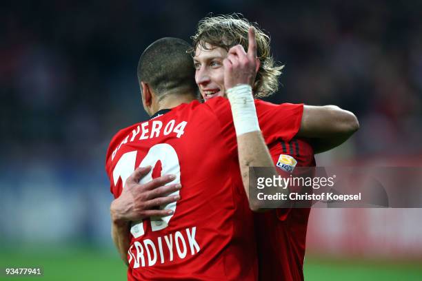 Stefan Kiessling of Leverkusen celebrates after scoring his team's first goal with team mates Eren Derdiyok of Leverkusen during the Bundesliga match...