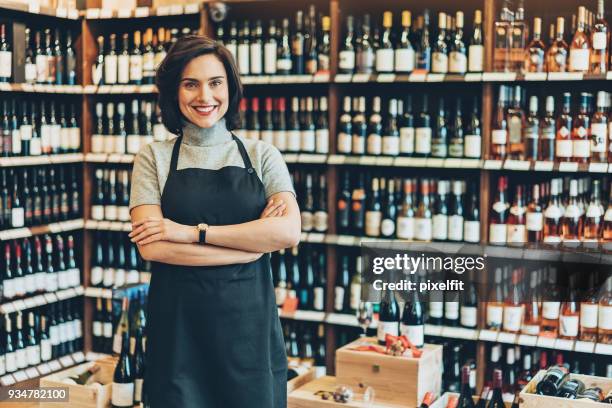 wine shop manager - bottle shop stock pictures, royalty-free photos & images