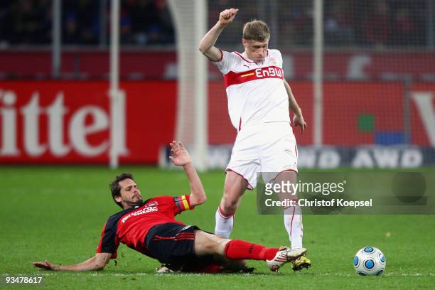 Manuel Friedrich of Leverkusen is challenged by Pavel Pogrebnyak of Stuttgart during the Bundesliga match between Bayer Leverkusen and VfB Stuttgart...