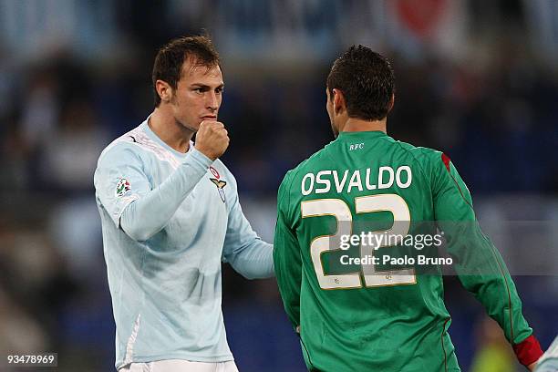 Stefan Radu of SS Lazio gestures to Pablo Daniel Osvaldo of Bologna FC during the Serie A match between Lazio and Bologna at Stadio Olimpico on...