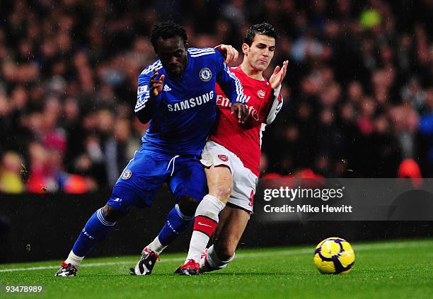 Cesc Fábregas of Arsenal challenges Michael Essien of Chelsea during the Barclays Premier League match between Arsenal and Chelsea at the Emirates...