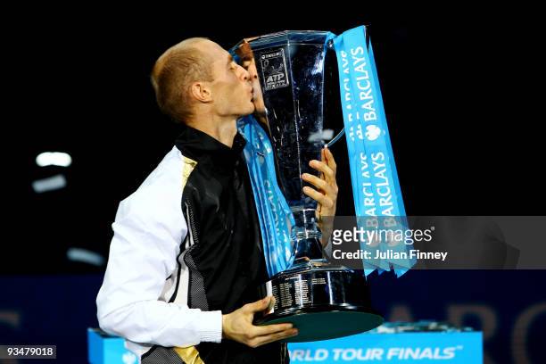 Nikolay Davydenko of Russia kisses the trophy as he celebrates winning the men's singles final match against Juan Martin Del Potro of Argentina...