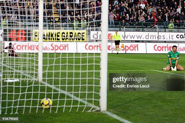 Juventus goalkeeper Gianluigi Buffon looks back at the goal while Alessandro Matri of Cagliari celebrates after scoring the 2:0 goal during the Serie...