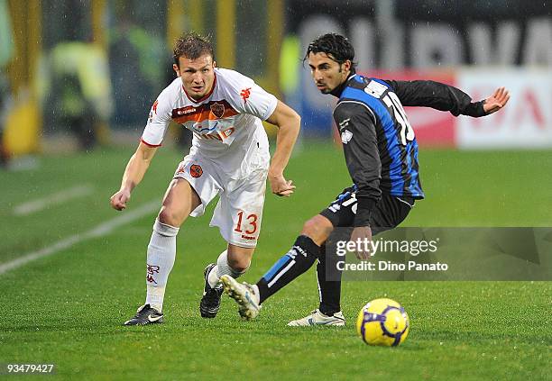 Fabio Giovanni Ceravolo of Atalanta compete with Marco Motta of Roma during the Serie A match between Atalanta and Roma at Stadio Atleti Azzurri...