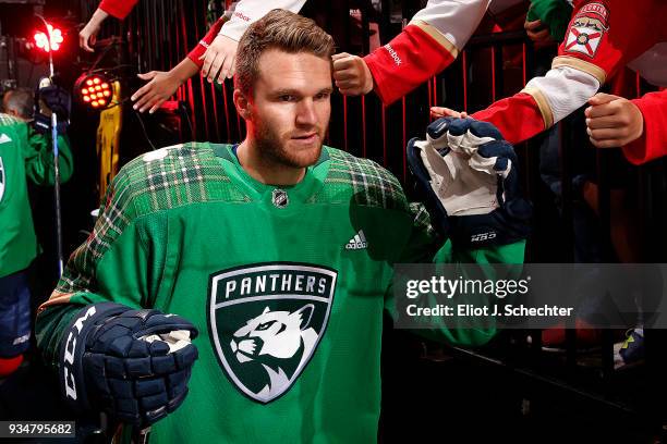 Jonathan Huberdeau of the Florida Panthers is greeted by fans on his way out to the ice for warm ups prior to the start of the game against the...