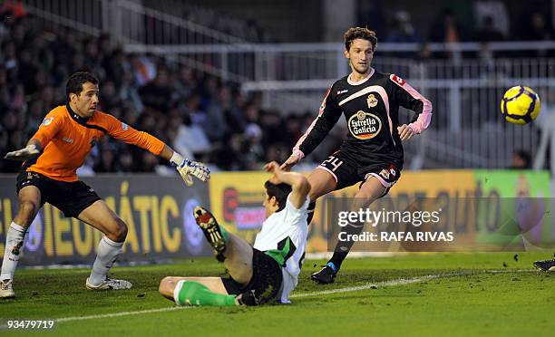 Racing's Jose Moraton falls on the field next to his team's goalkeeper Tono Rodriguez and Deportivo's Mista during a Spanish league football match,...