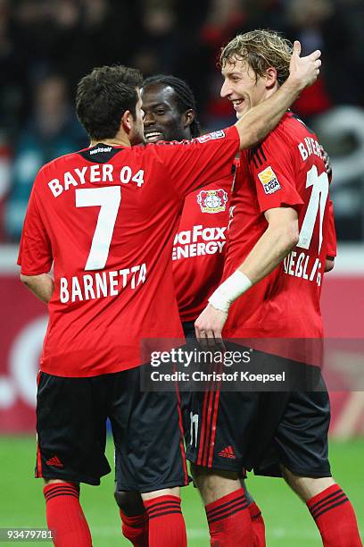 Stefan Kiessling of Leverkusen celebrates his third goal with team mates Tranquillo Barnetta and Hans Sarpei during the Bundesliga match between...