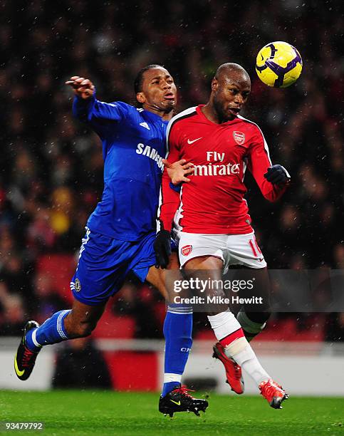 William Gallas of Arsenal challenges Didier Drogba of Chelsea during the Barclays Premier League match between Arsenal and Chelsea at the Emirates...