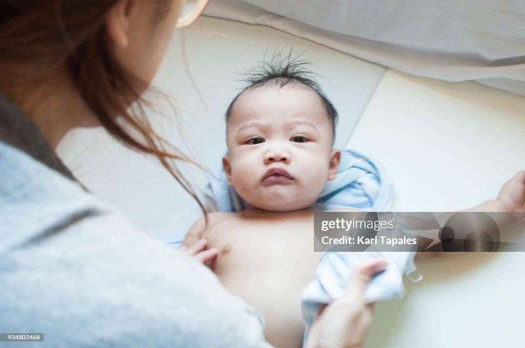 A portrait of a baby after taking bath