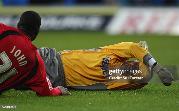 Cardiff City goalkeeper David Marshall lies in agony before being taken off injured during the Coca-Cola Championship game between Cardiff City and...