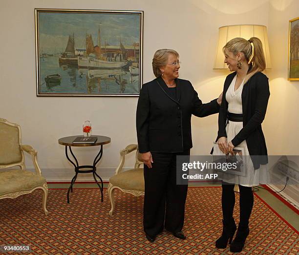 Chile's President Michelle Bachelet meets with Colombina singer Shakira on November 29, 2009 in Lisbon. Shakira, representing the Alas Foundation met...