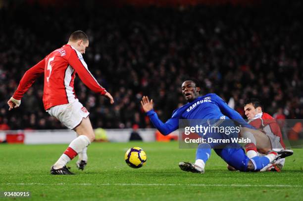 Michael Essien of Chelsea is challenged by Cesc Fábregas of Arsenal during the Barclays Premier League match between Arsenal and Chelsea at the...