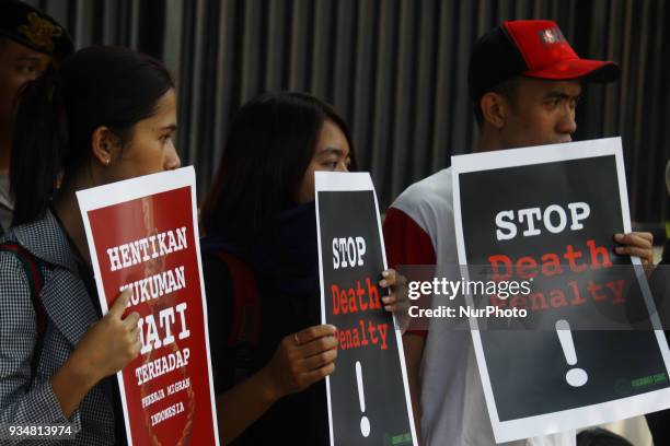Dozens of activist from Migrant Care organization held a protest outside Saudi Arabia embassy in Jakarta, Tuesday, March 20, 2018. They condemned the...