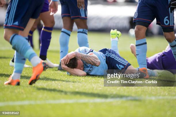 March 11: Maxime Chanot of New York City holds his head after a head clash with Jonathan Spector of Orlando City during the New York City FC Vs...