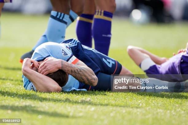 March 11: Maxime Chanot of New York City holds his head after a head clash with Jonathan Spector of Orlando City during the New York City FC Vs...