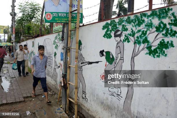 The capital city of Dhaka. Mural painting and graffitis illustrating the Bangladesh Liberation War of 1971, in Dhaka, the capital of Bangladesh in...
