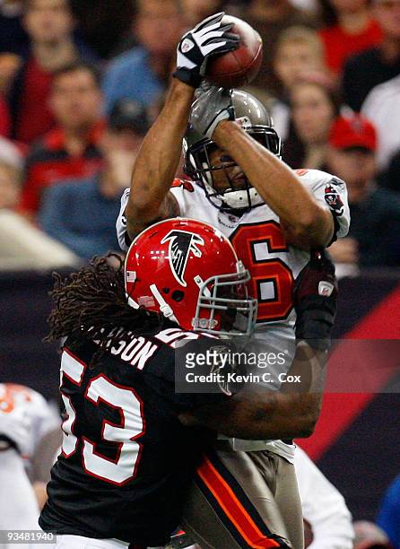 Jerramy Stevens of the Tampa Bay Buccaneers pulls in this reception against Mike Peterson of the Atlanta Falcons at Georgia Dome on November 29, 2009...