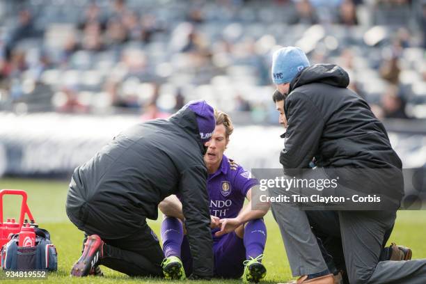 March 11: Jonathan Spector of Orlando City is treated by medical staff after a head clash during the New York City FC Vs Orlando City SC regular...