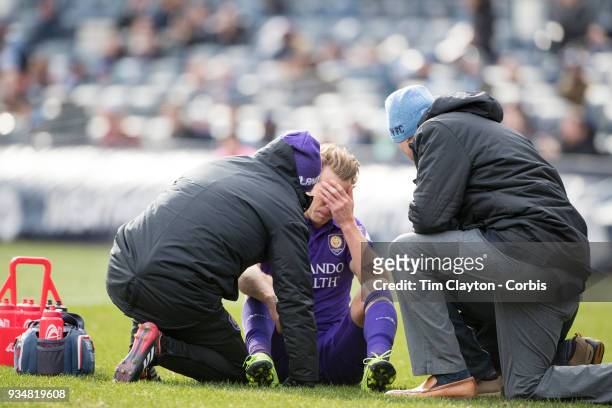 March 11: Jonathan Spector of Orlando City is treated by medical staff after a head clash during the New York City FC Vs Orlando City SC regular...