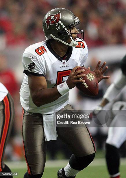 Josh Freeman of the Tampa Bay Buccaneers rolls out looking to pass against the Atlanta Falcons at the Georgia Dome on November 29, 2009 in Atlanta,...