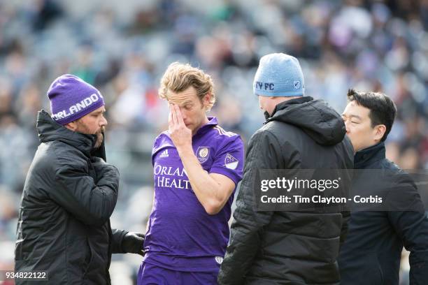 March 11: Jonathan Spector of Orlando City is treated by medical staff after a head clash during the New York City FC Vs Orlando City SC regular...