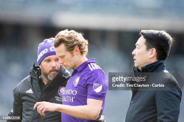 March 11: Jonathan Spector of Orlando City is treated by medical staff after a head clash during the New York City FC Vs Orlando City SC regular...