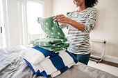 Woman folding towels