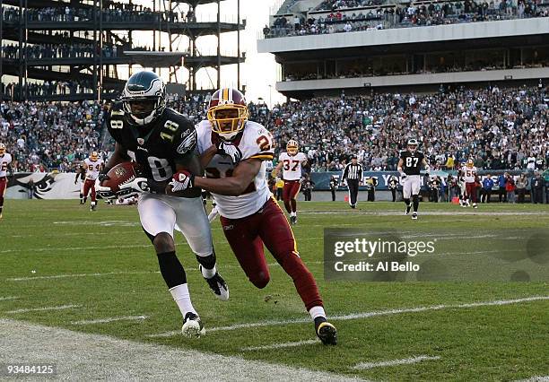 Jeremy Maclin of the Philadelphia Eagles makes a catch and is pushed out of bounds by Carlos Rogers of the Washington Redskins during their game at...