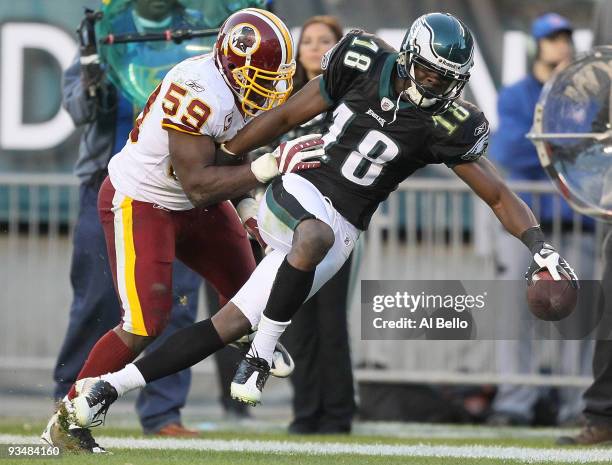 Jeremy Maclin of the Philadelphia Eagles makes a catch and is pushed out of bounds by London Fletcher of the Washington Redskins during their game at...